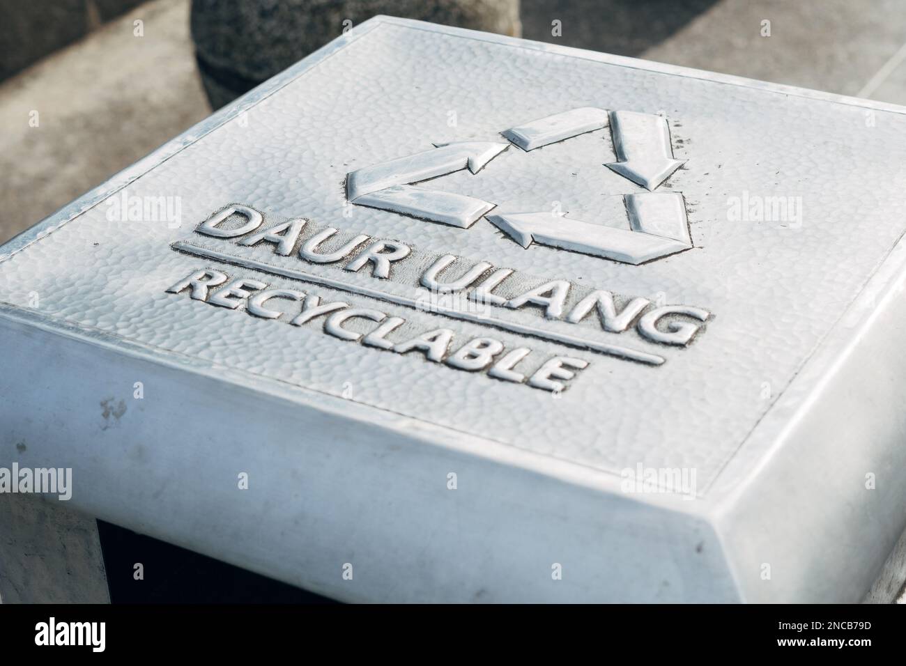Recyclable text sign symbol on trash bin Stock Photo Alamy