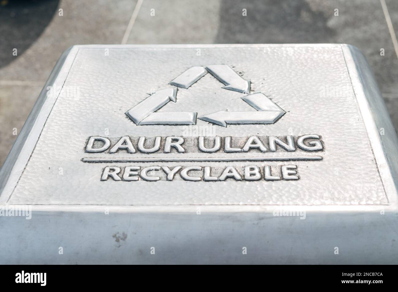 Recyclable text sign symbol on trash bin Stock Photo Alamy