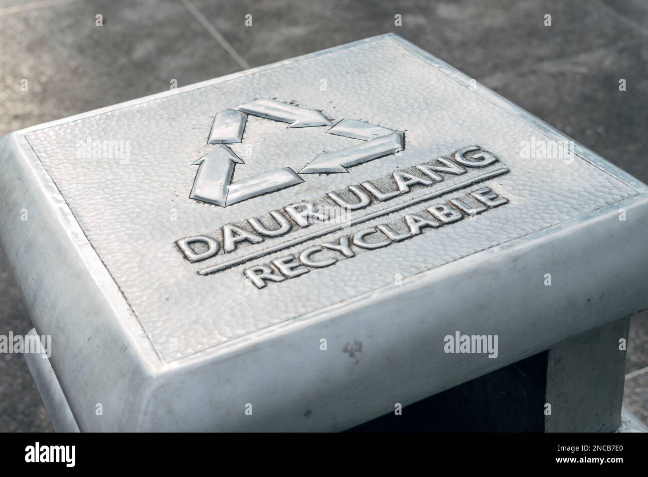 Recyclable text sign symbol on trash bin Stock Photo Alamy