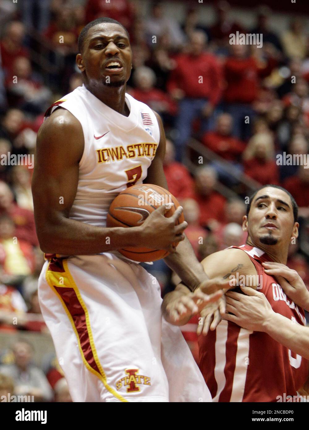 Iowa State forward Melvin Ejim, left, grabs a rebound over Oklahoma