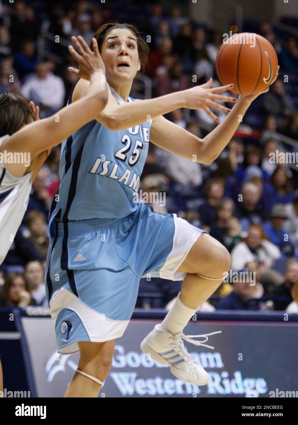 Rhode Island forward Lara Gasper (25) goes up for a shot against Xavier  guard Megan Askew, left, in the second half of an NCAA college basketball  game, Saturday, Jan. 29, 2011, in