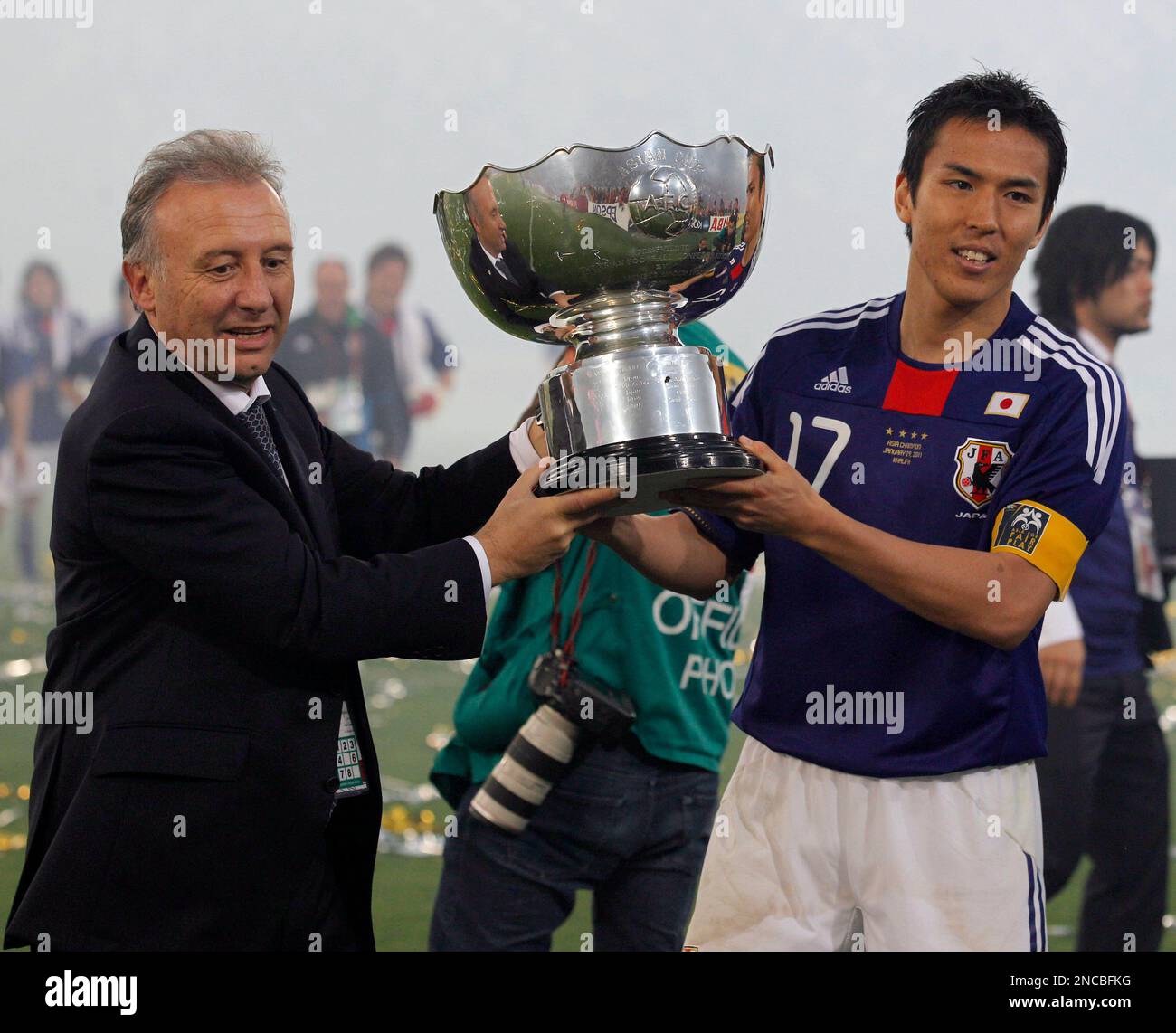 Japan's team coach Alberto Zaccheroni of Italy, left, and player