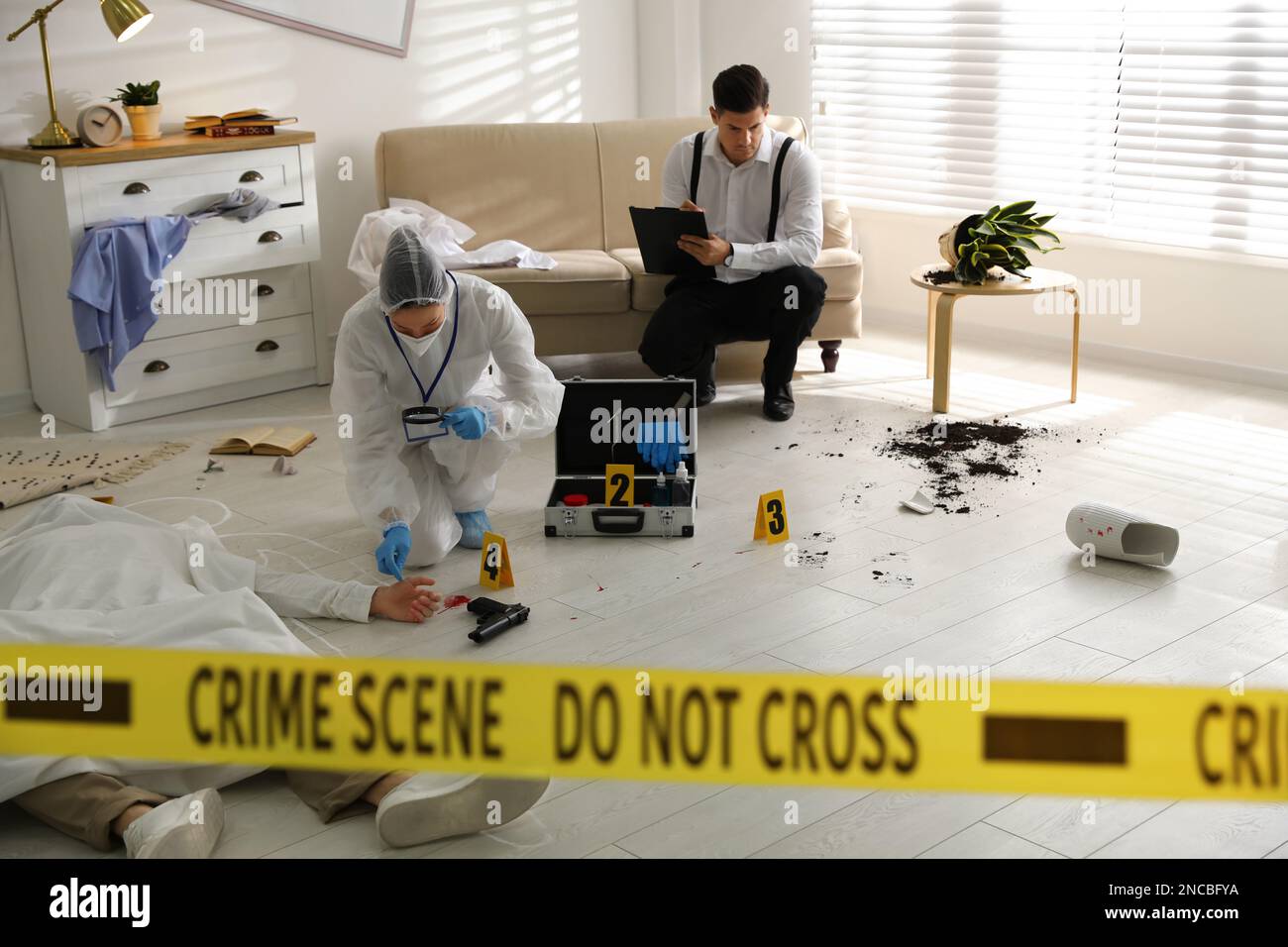 Investigators working at crime scene with dead body Stock Photo Alamy