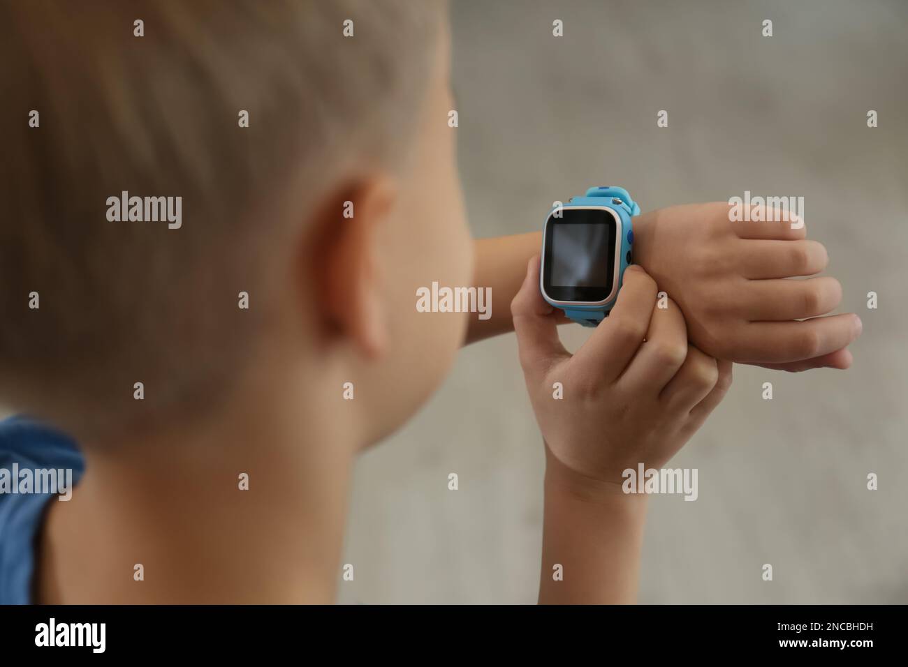 Boy with stylish smart watch, closeup view Stock Photo