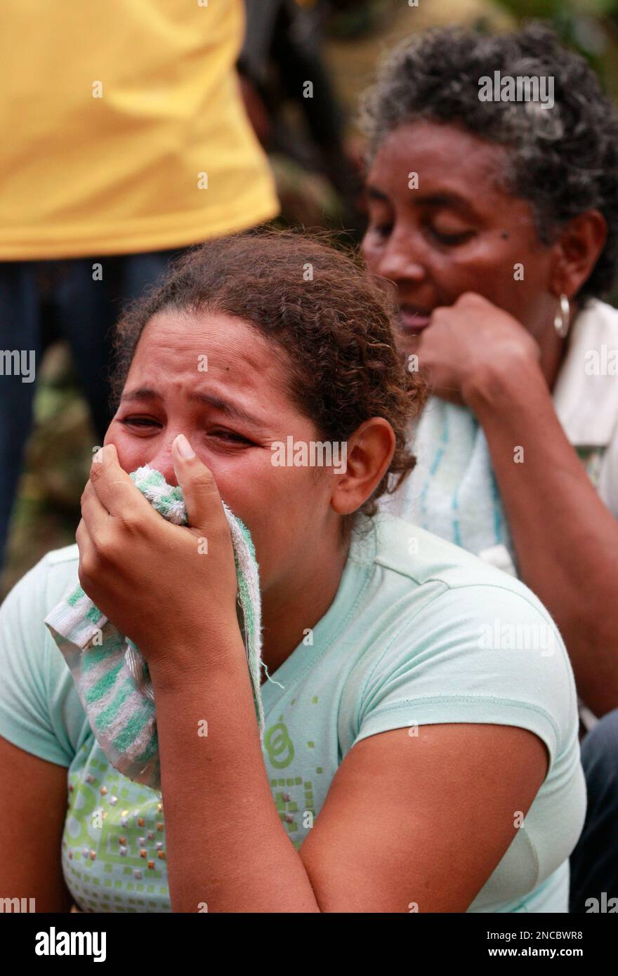 Caterine Zapata, wife of miner Jorge Lara, reacts at La Preciosa mine