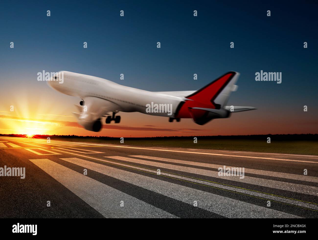 Modern white airplane landing on runway Stock Photo - Alamy