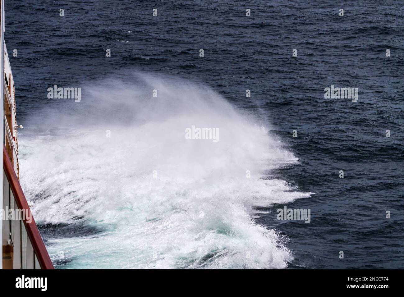 Bow of cruise ship in heavy seas and swell with waves crashing from the