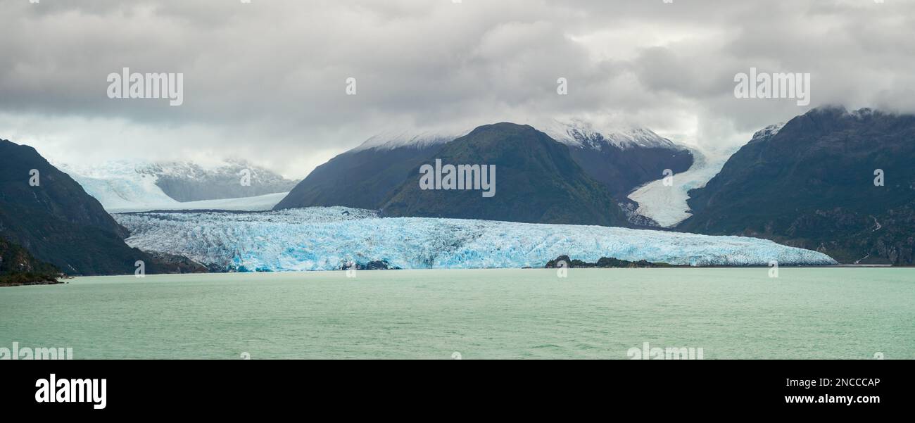 Panorama of Amalia glacier with detail of the fissures and rocks in its path Stock Photo