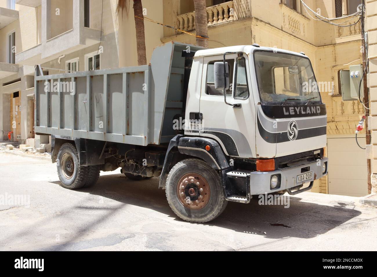 A vintage Leyland T45 tipper, now bestowed with Classic Commercial status, awaits its next task on a building site in Xaghra, Gozo, Malta, June 2022. Stock Photo