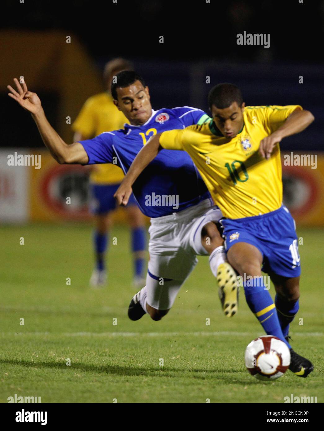 Brazil's Lucas Rodrigues, right, fights for the ball with Colombia's