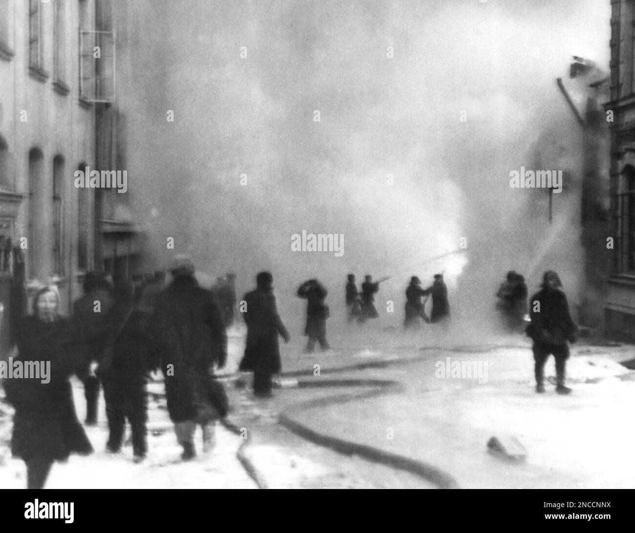 Firefighters work furiously to subdue a fire in a Finnish town that ...