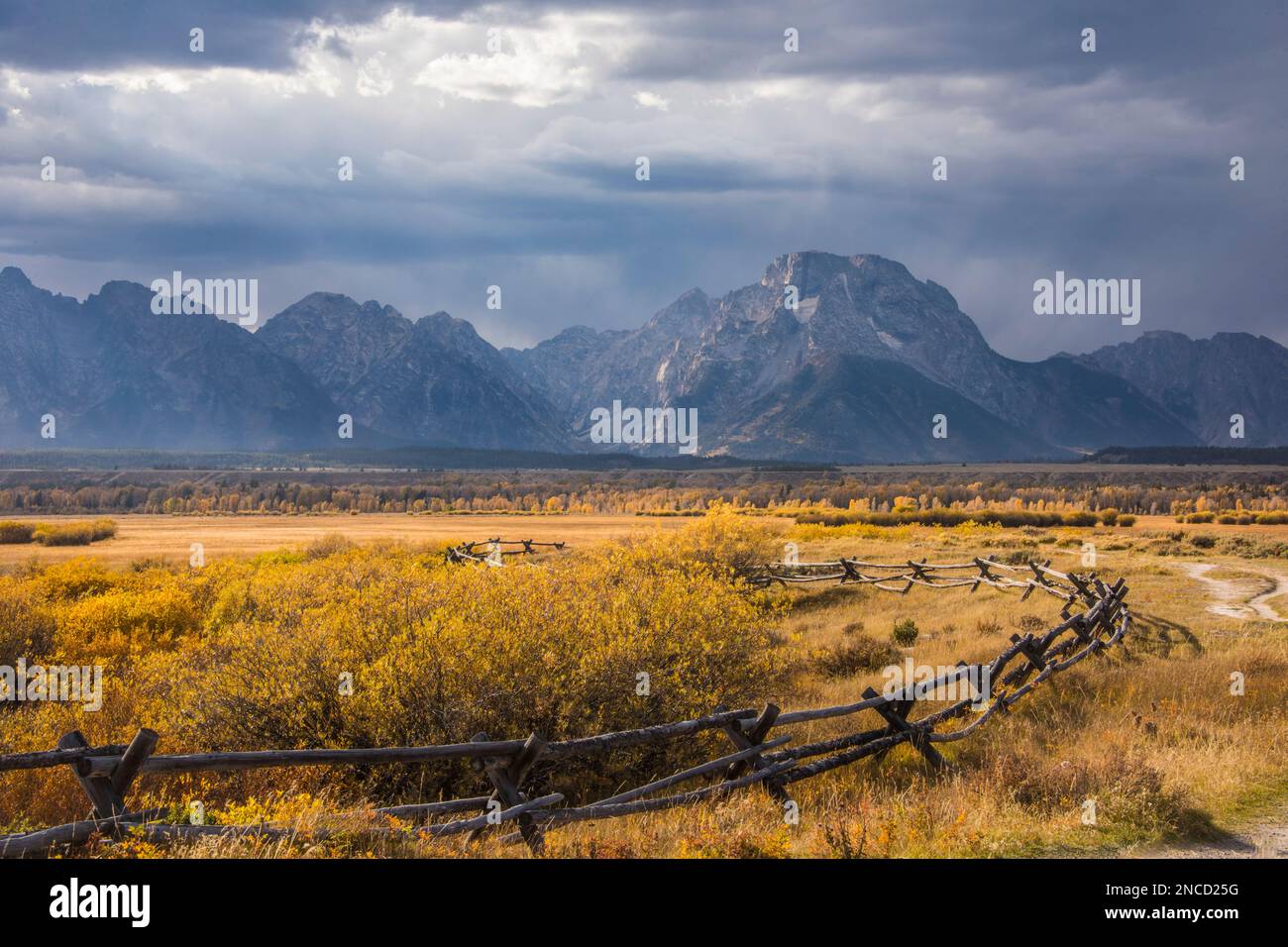 A storm clears over the Teton Range and Mt Moran as seen from historical Cunningham Cabin, Grand Teton National Park, Wyoming, USA Stock Photo