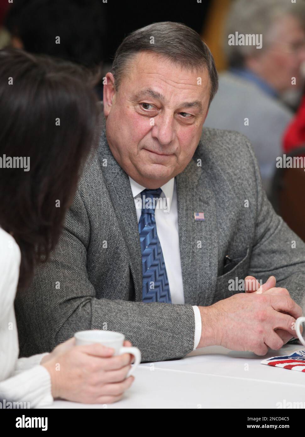 Gov. Paul LePage speaks with an unidentified woman Monday, Jan. 17