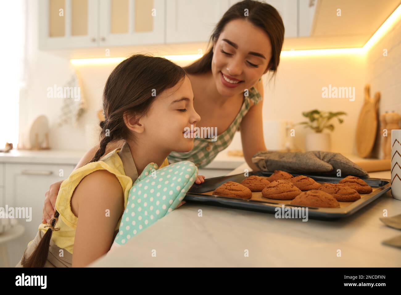 Woman smelling baked cookies hires stock photography and images Alamy