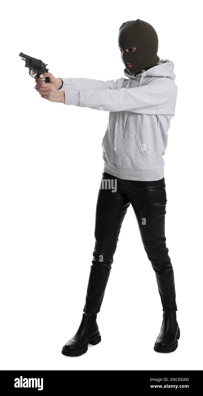 Woman wearing knitted balaclava with gun on white background Stock