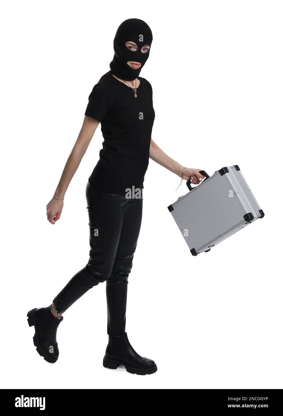 Woman wearing knitted balaclava with metal briefcase on white