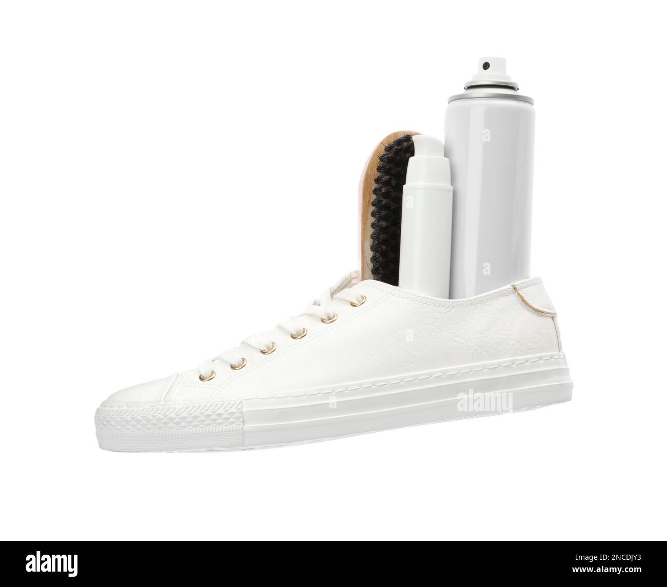 Stylish footwear with shoe care accessories on white background Stock