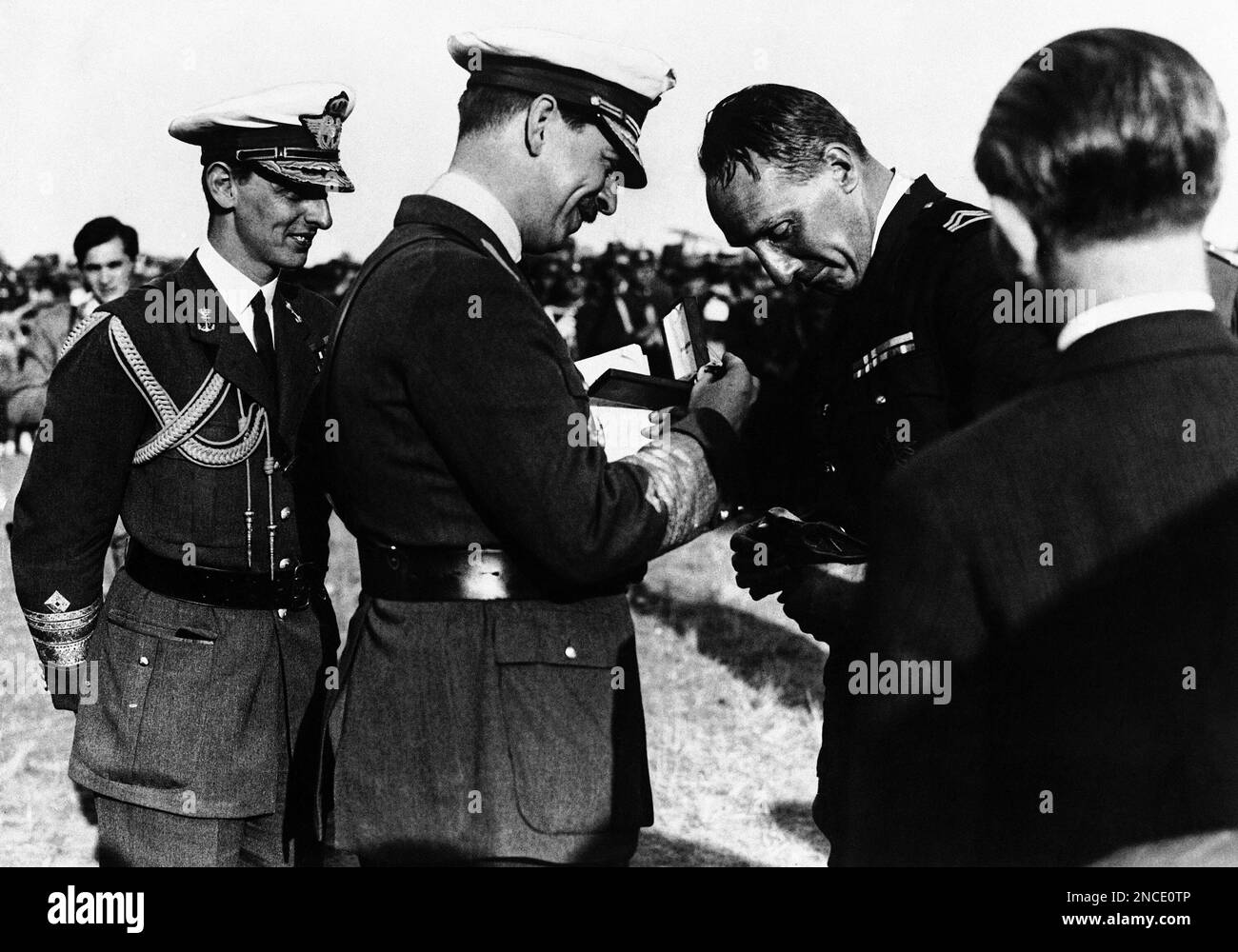 King Carol II of Romania decorating the Duke of Bourbon and Orleans ...