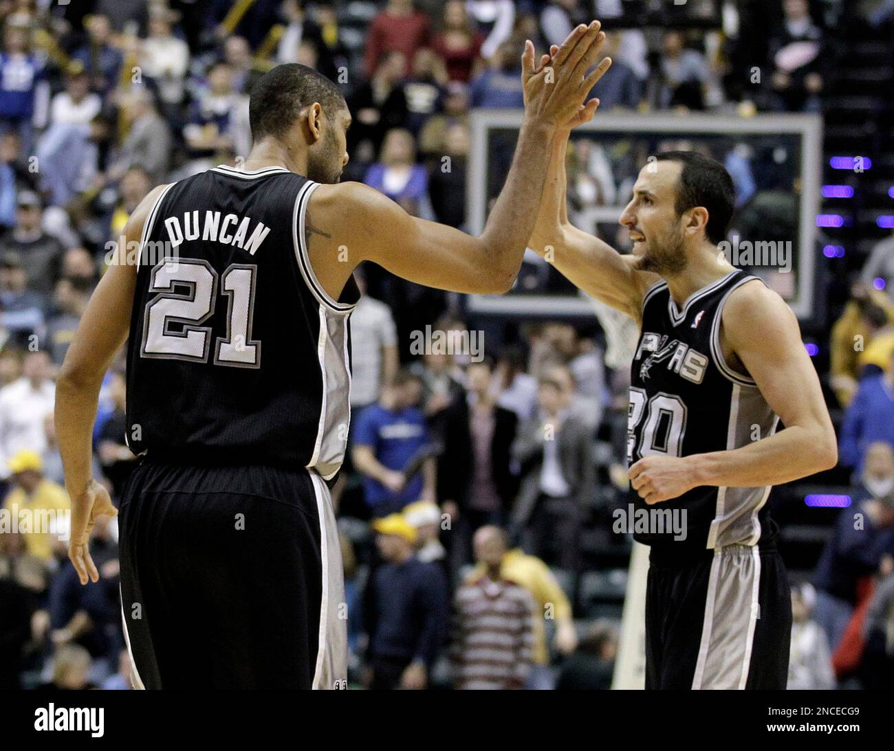 San Antonio Spurs center Tim Duncan, left, and San Antonio Spurs guard Manu Ginobili of Argentina react during the fourth quarter of an NBA basketball game against the Indiana Pacers in Indianapolis, Friday, Jan. 7, 2011. San Antonio won 90-87. (AP Photo/Darron Cummings) Stock Photo