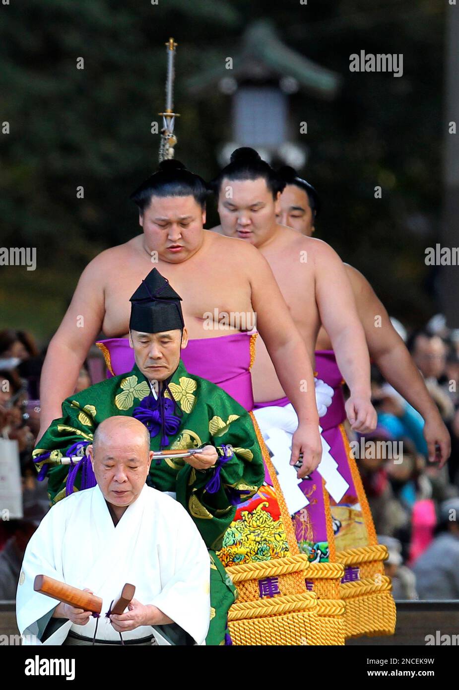 Mongolian sumo grand champion Hakuho, second from back, in ceremonial ...