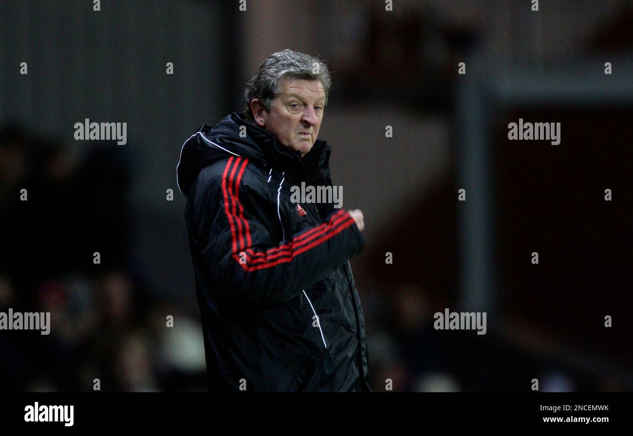 Liverpool's manager Roy Hodgson stands on the touchline during his team