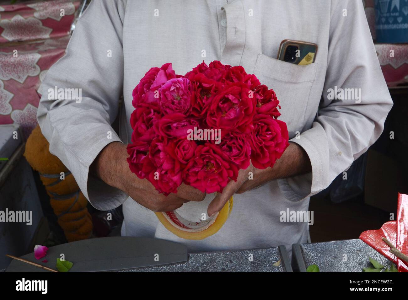 Peshawar, Pakistan. 14th Feb, 2023. People buy flowers at a flower shop
