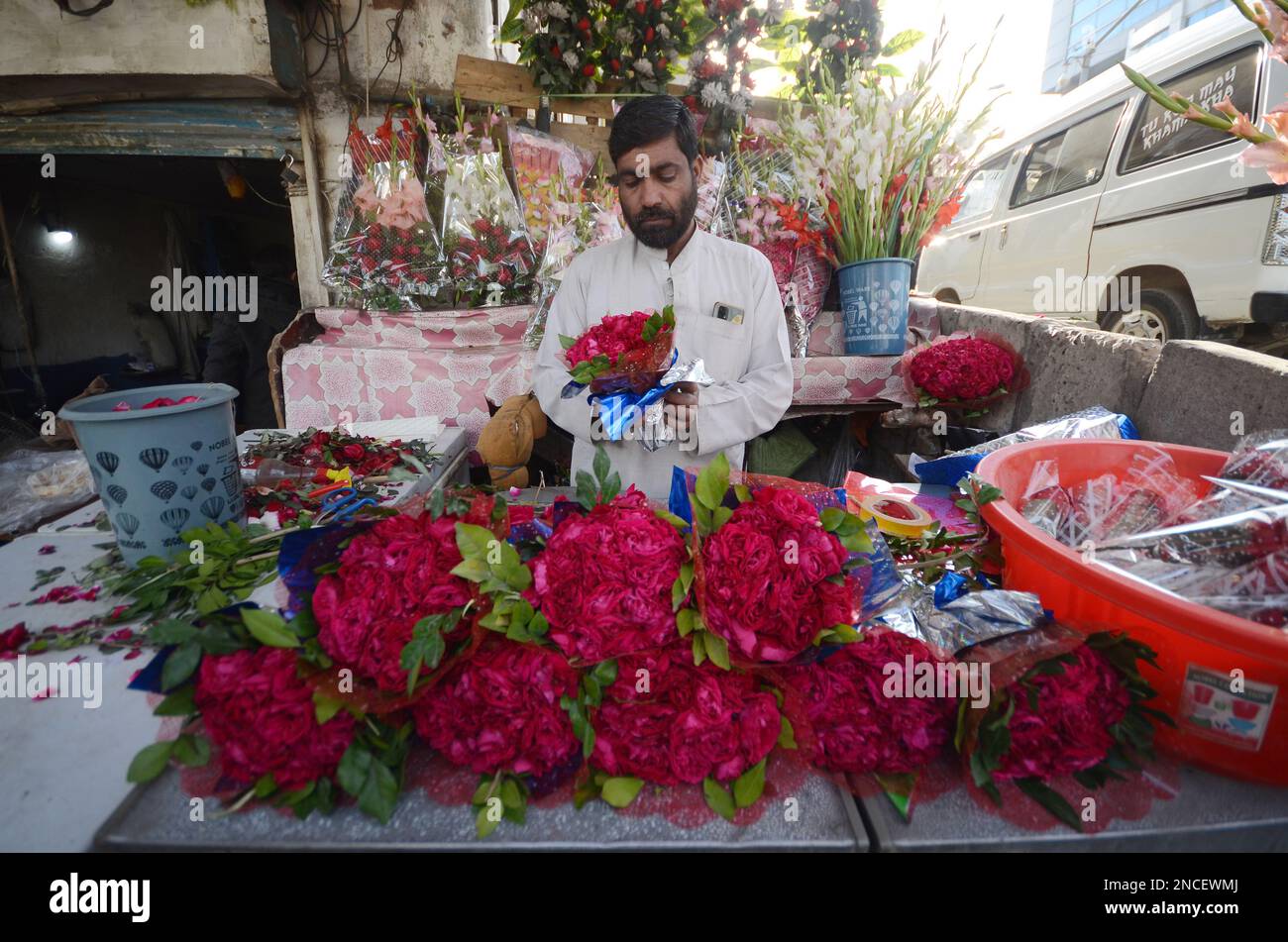 Peshawar, Pakistan. 14th Feb, 2023. People buy flowers at a flower shop