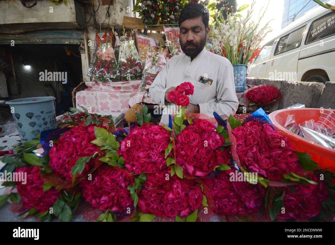 Peshawar, Pakistan. 14th Feb, 2023. People buy flowers at a flower shop