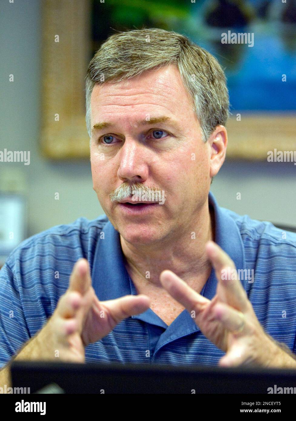 C. Mark Franklin talks with AP reporter Dina Cappiello about software that he developed