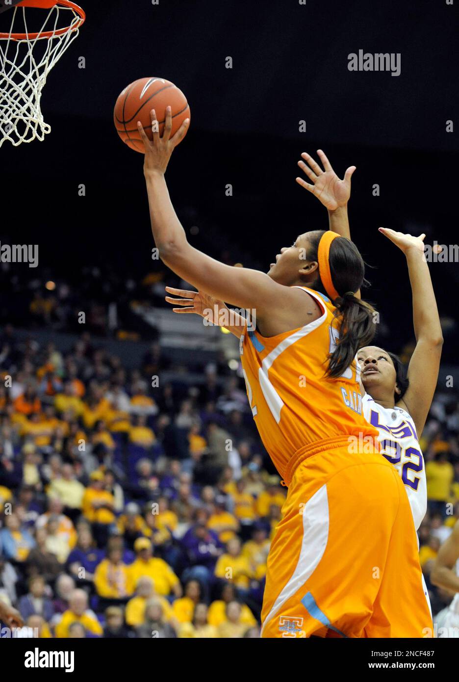 Tennessee center Kelley Cain, left, works her way around LSU forward  Courtney Jones, right, to score two of her 19-points during the second half  of an NCAA college basketball game Sunday, Jan.
