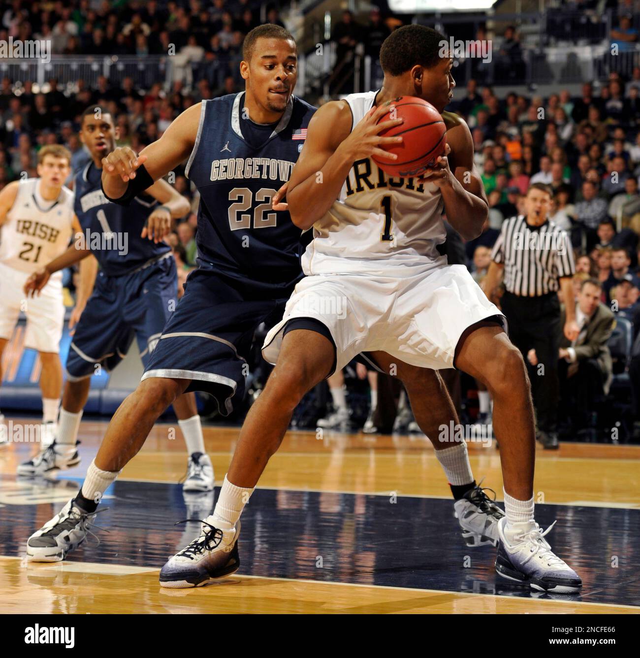 Notre Dame forward Tyrone Nash, right, drives the lane as