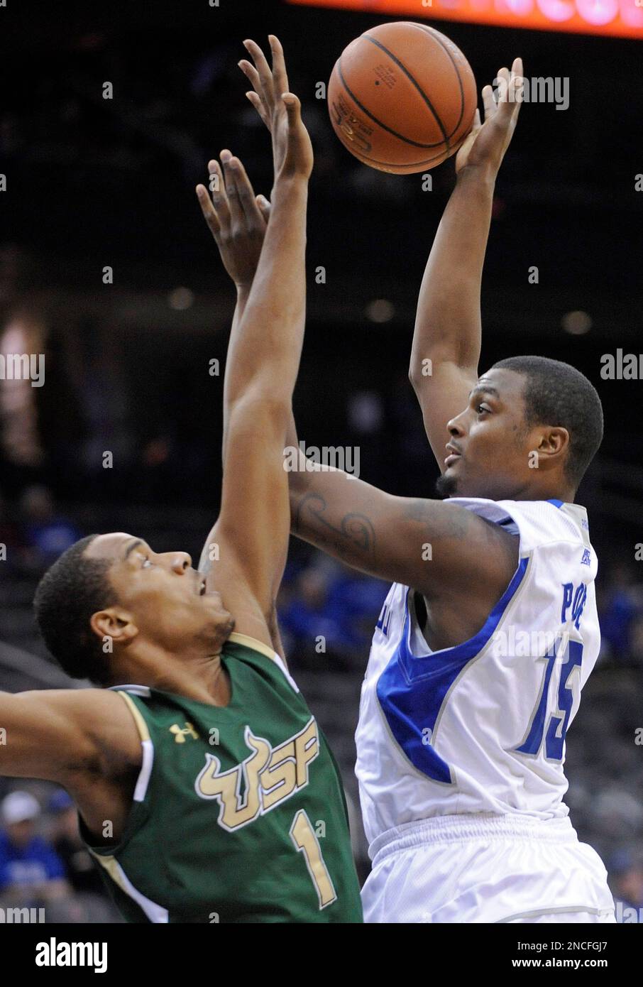 Seton Hall's Herb Pope, right, puts up a shot over South Florida's Ron ...