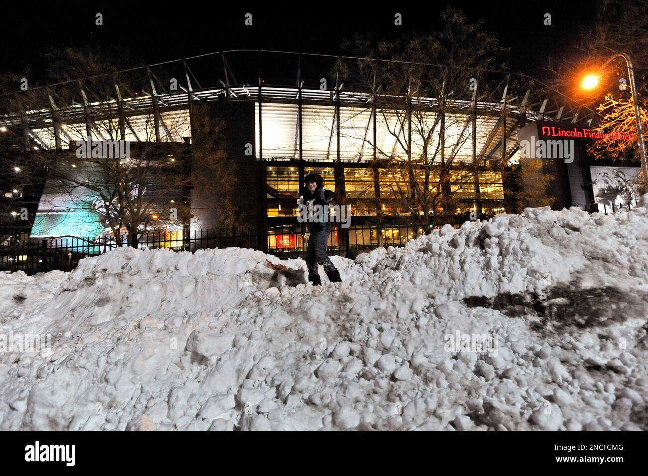 Garrett Jenkins, 11, of Mertztown, Pa., throws a snowball in the parking  lot of Lincoln Financial Field before an NFL football game between the  Philadelphia Eagles and the Minnesota Vikings, Tuesday, Dec.