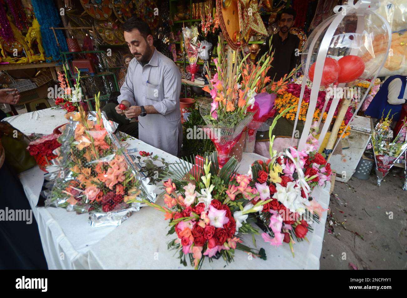 Peshawar, Khyber Pakhtunkhwa, Pakistan. 14th Feb, 2023. People buy