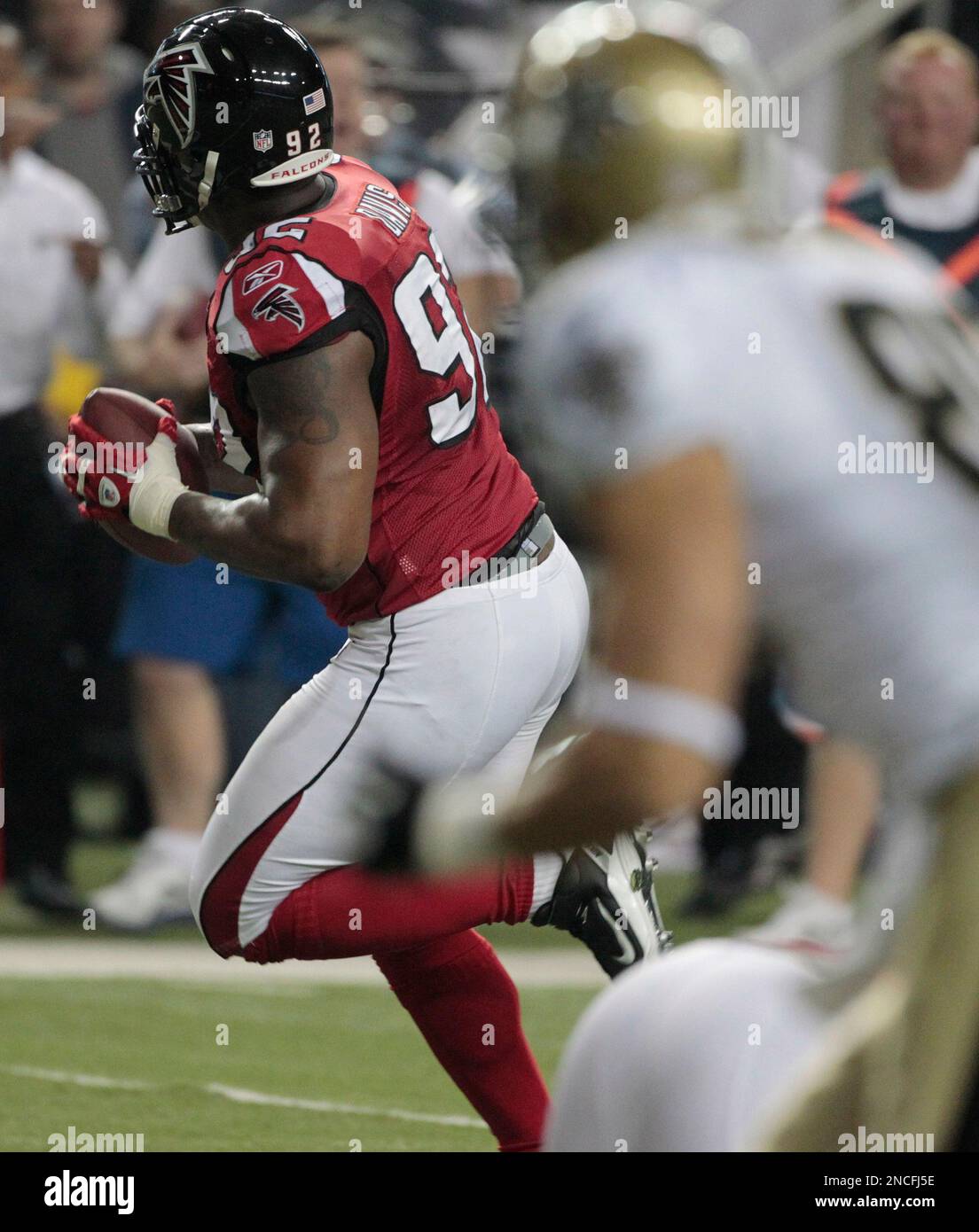 Atlanta Falcons defensive end Chauncey Davis (92) stretches during pregame  workouts before a NFL football game with the Tampa Bay Buccaneers Sunday,  Jan. 3, 2010 in Tampa, Fla. (AP Photo/Steve Nesius Stock