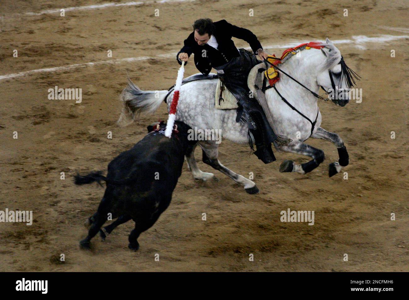 Spain's mounted bullfighter Andy Cartagena drives a banderilla into a