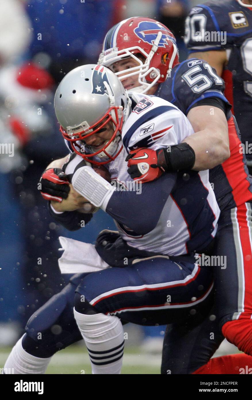 New England Patriots' Brian Hoyer is tackled by Buffalo Bills' Paul