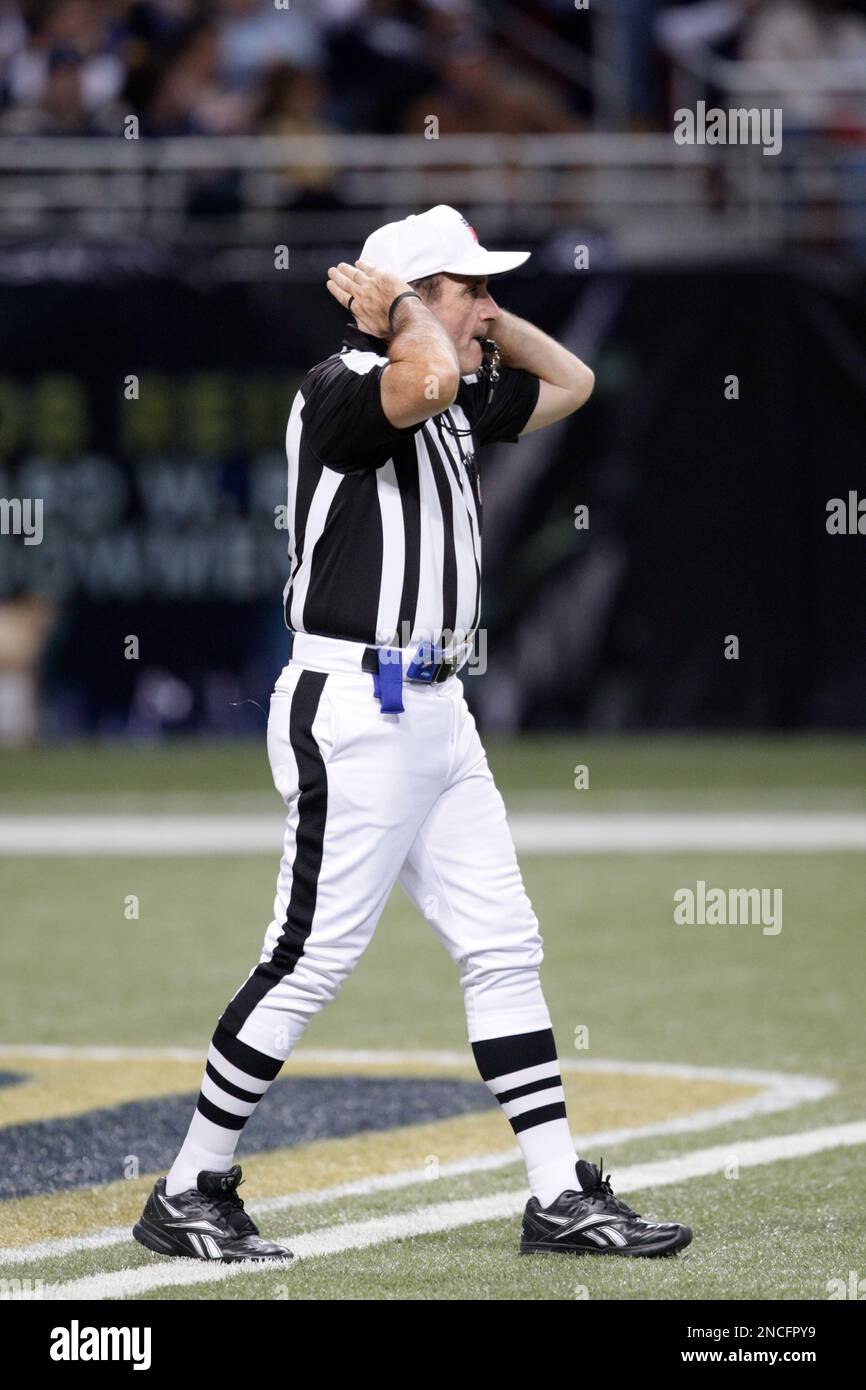 Referee Pete Morelli (135) signals for the play to start during the