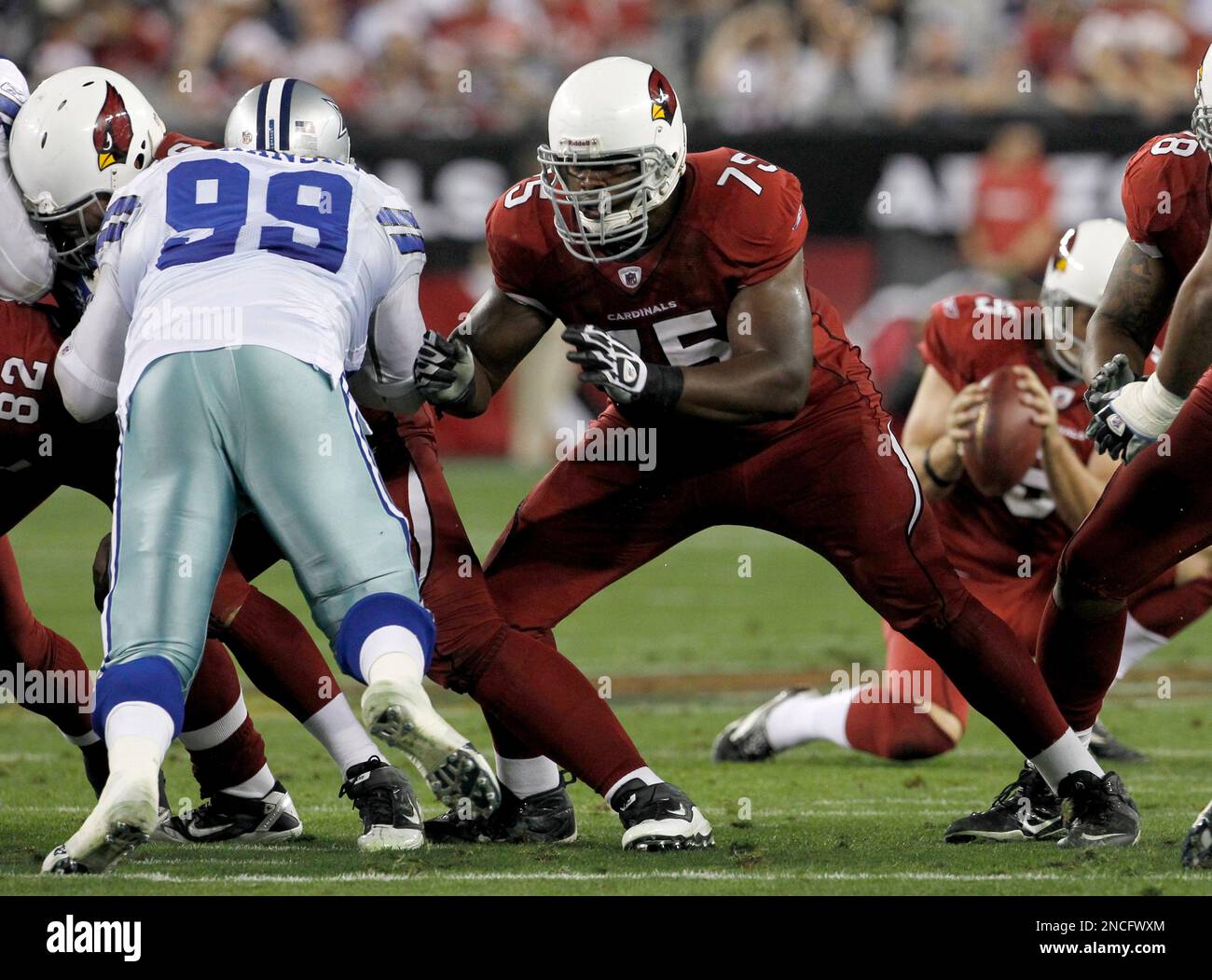 Arizona Cardinals' Levi Brown (75) block Dallas Cowboys' Igor Olshansky  (99) during an NFL football game