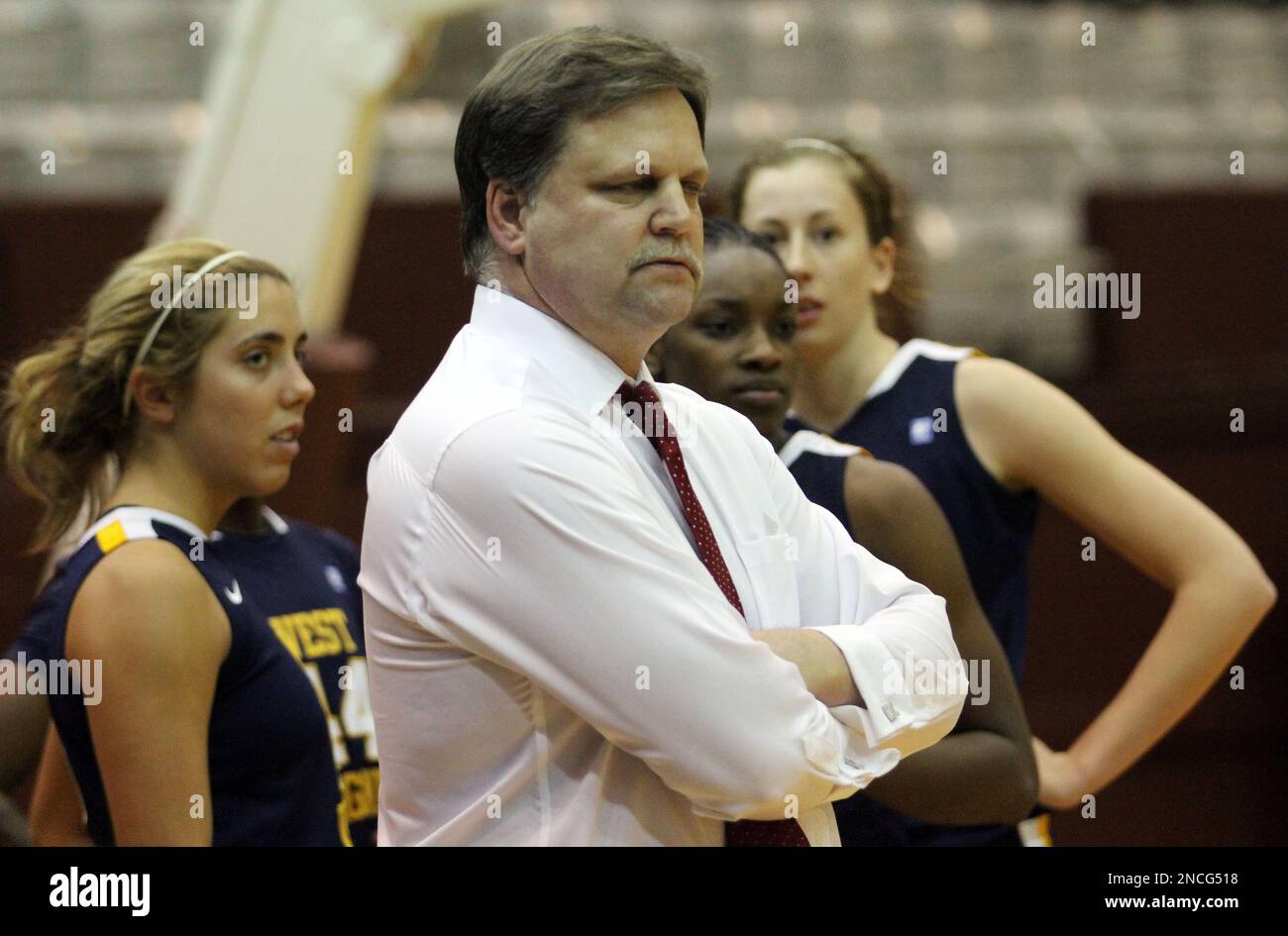 West Virginia head coach Mike Carey looks on during the first half of