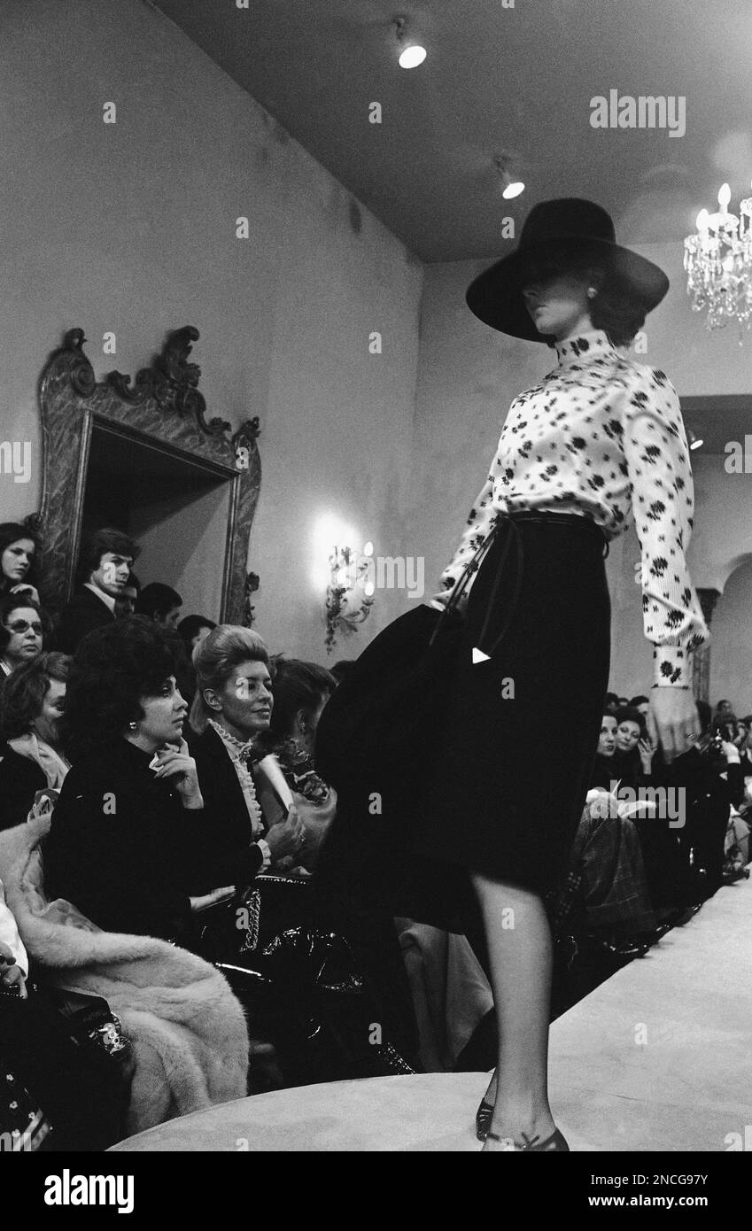Italian actress Gina Lollobrigida left admires this light black