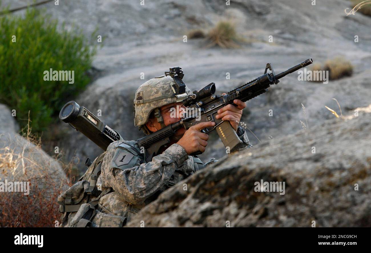 Sgt Rafiq Staff Sgt. Michael Bruzeis left, from Secaucus NJ, look towards the ...