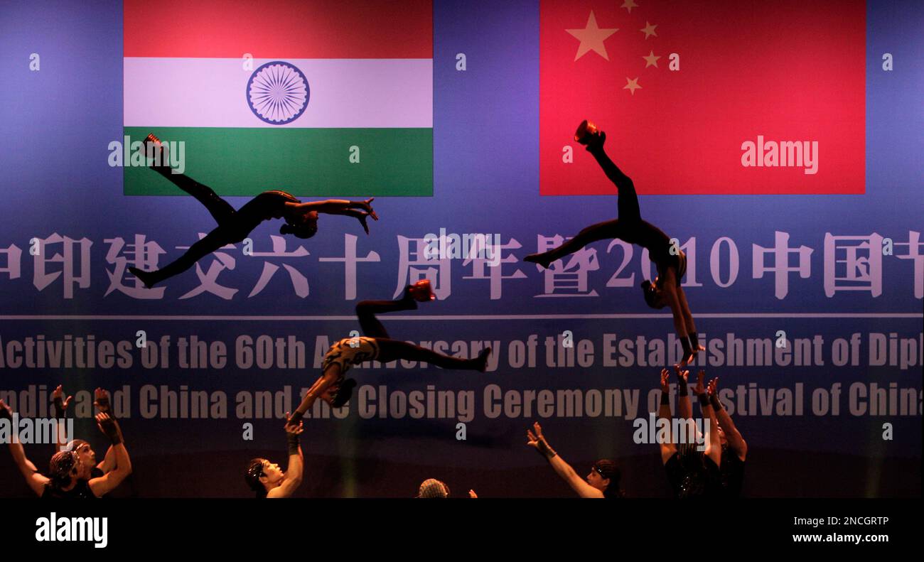 Chinese acrobat artists perform at the closing ceremony of the Festival of China in India and the 60th anniversary of the established diplomatic relations between the two countries, in New Delhi, India, Thursday, Dec. 16, 2010. The leaders of India and China called Thursday for a stronger partnership, a huge increase in trade and even the creation of an emergency hotline as they stressed a spirit of cooperation, not competition between Asia's two rising powers. (AP Photo/Manish Swarup) Stock Photo
