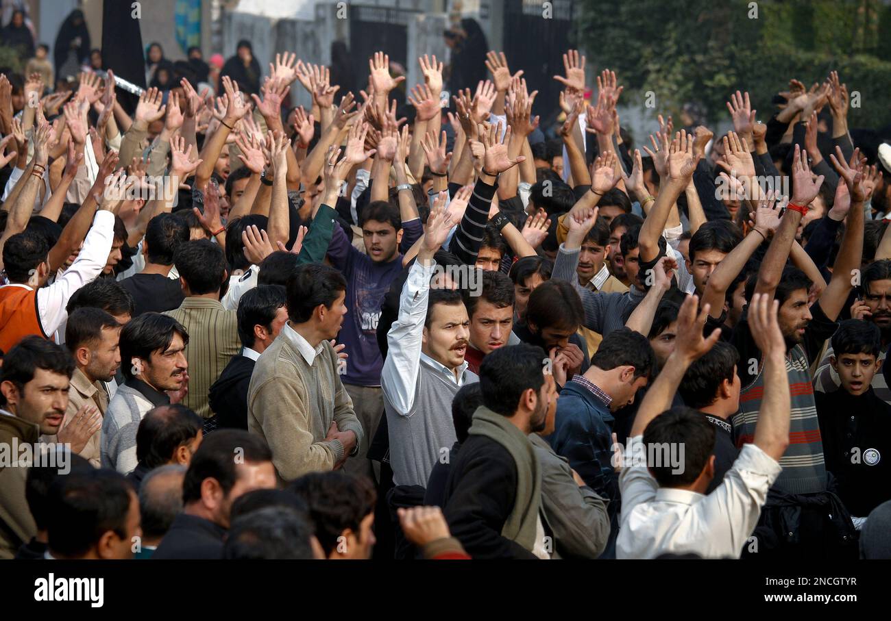 Pakistani Shiite Muslims shout religious slogans during a Muharram ...
