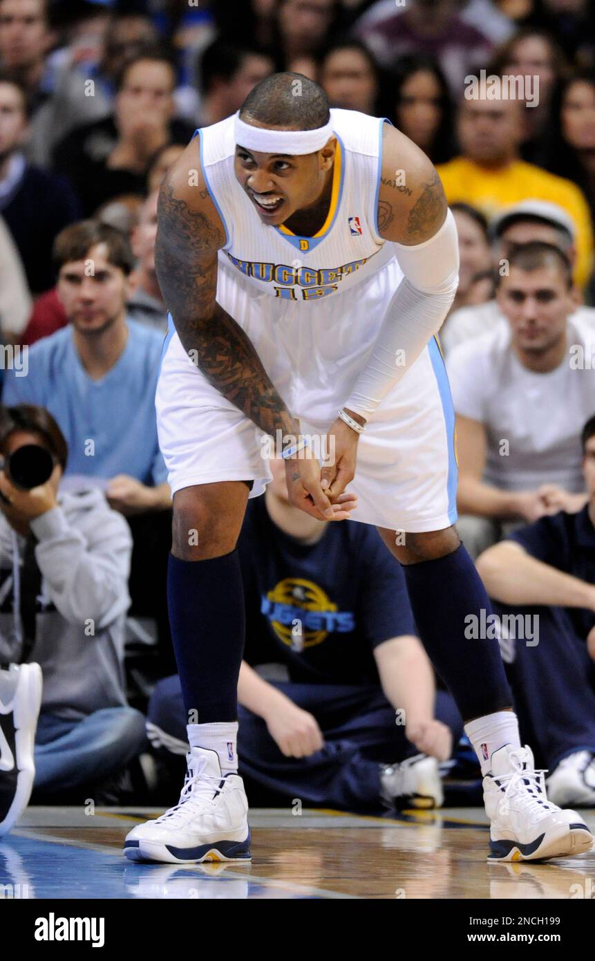 Denver Nuggets forward Carmelo Anthony grabs his fingers against the ...