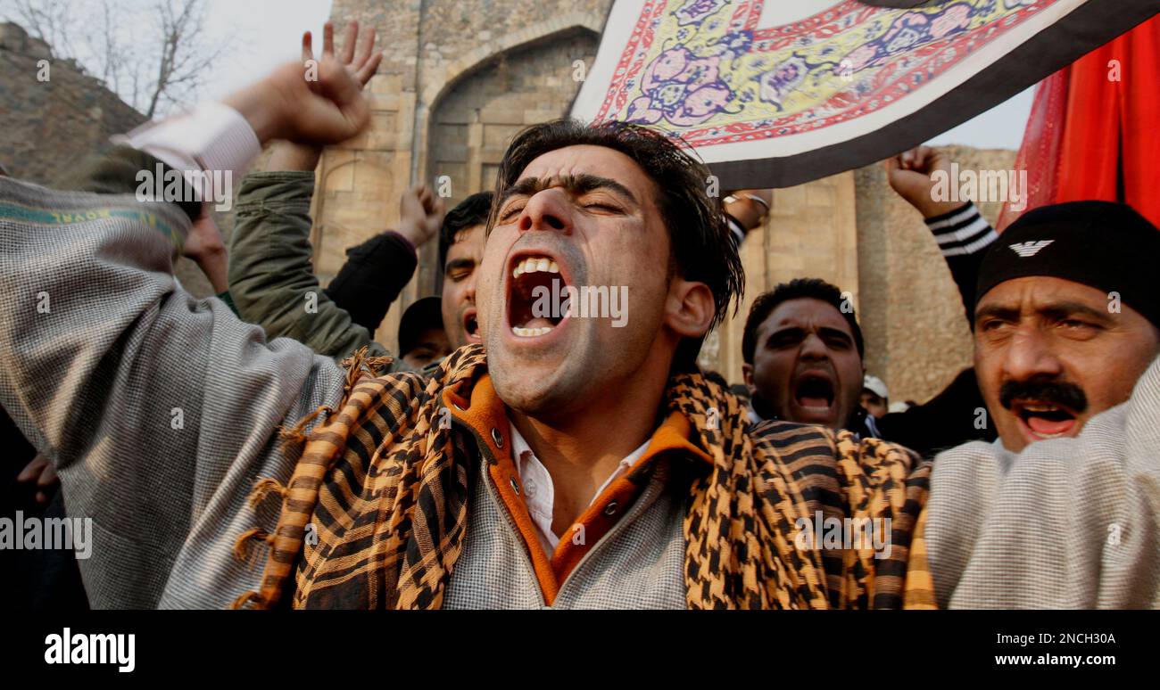 Kashmiri Shiite Muslims shout slogans against the U.S. during a ...