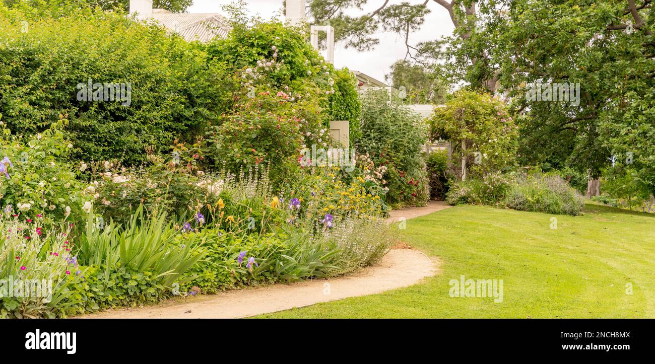 A beautiful long border in a traditional cottage garden Stock Photo