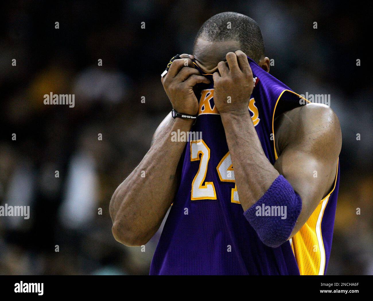 Los Angeles Lakers Kobe Bryant 24 wipes the sweat from his face before stepping to the free throw line in the second half against the New Jersey Nets during an NBA basketball