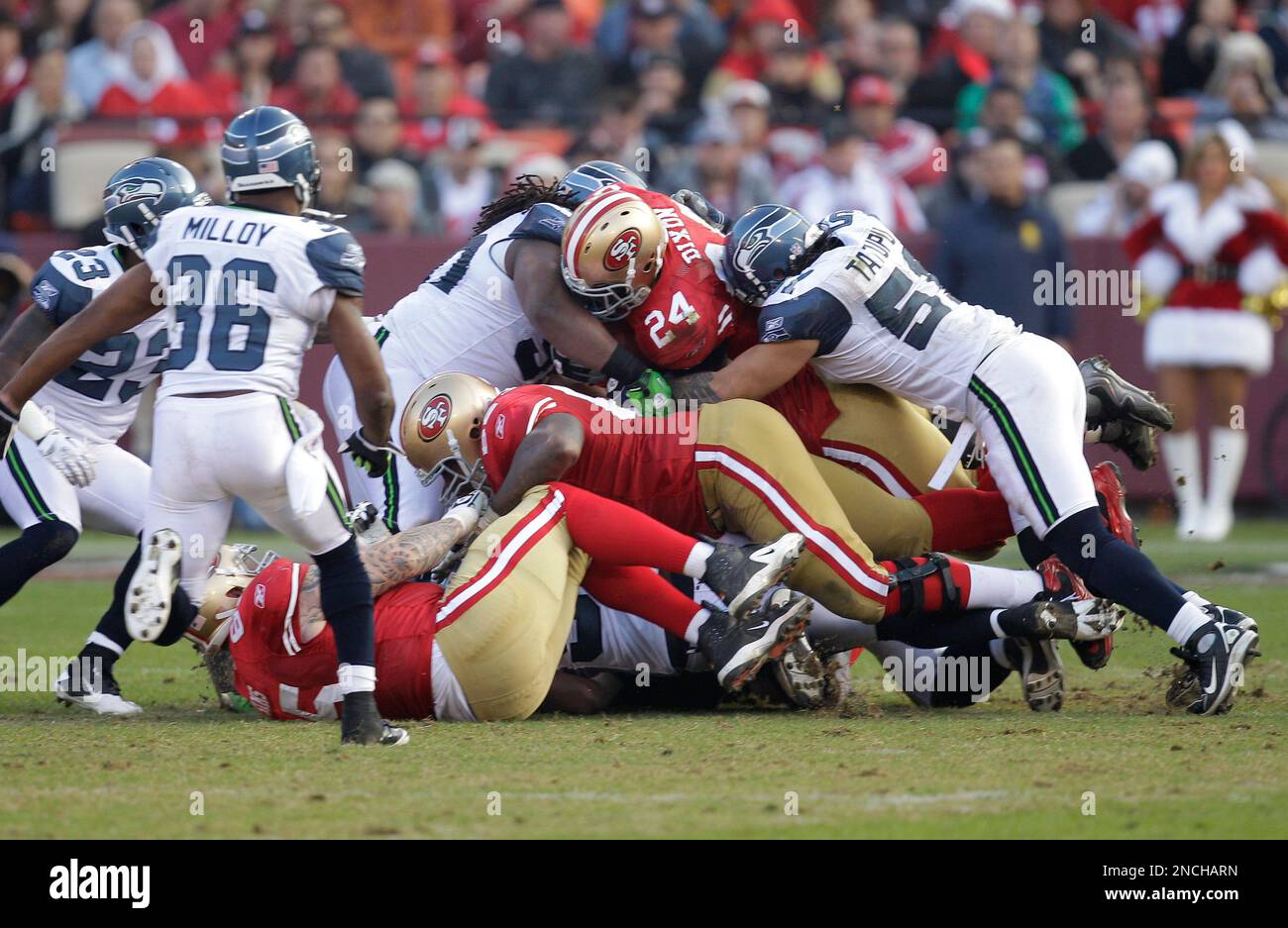 San Francisco 49ers running back Anthony Dixon (24) is tackled by San