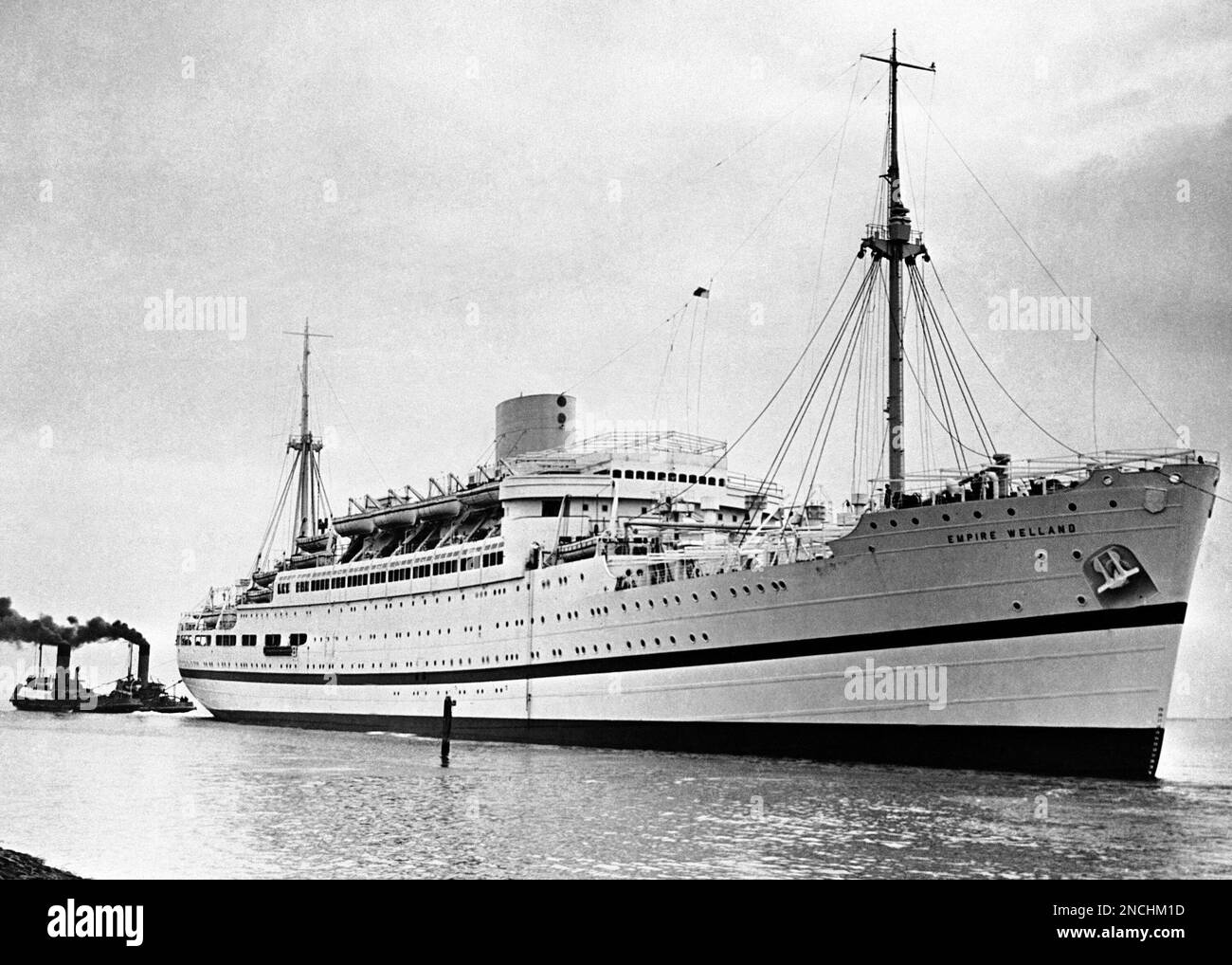 Liner Empire Welland , in her new coat of white paint with a blue line ...